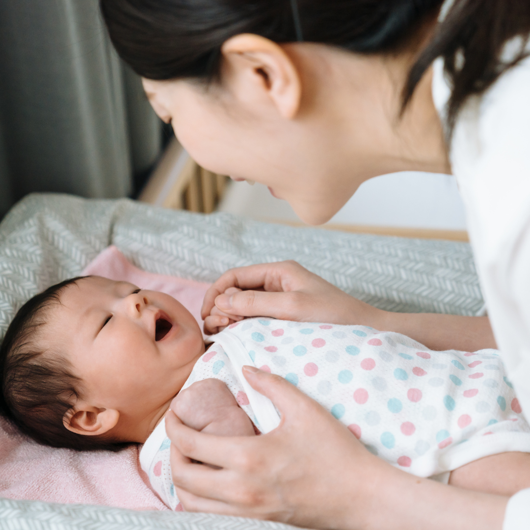 mom singing with baby