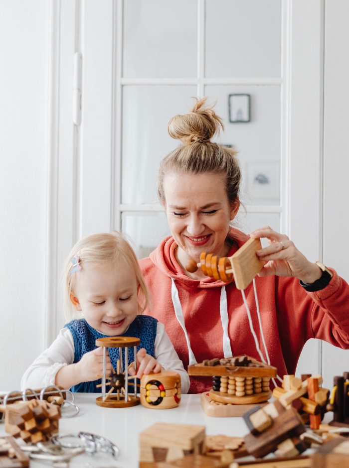 toddler learning through play with mom