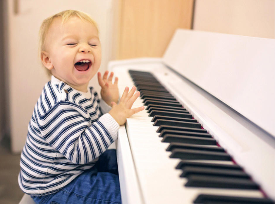 Happy Baby Playing Piano