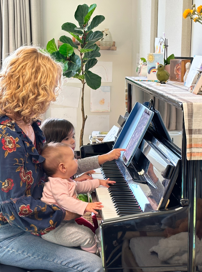 Piano Teacher and Babies Learning