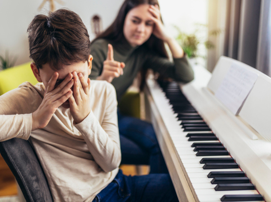 frustrated child at piano lesson