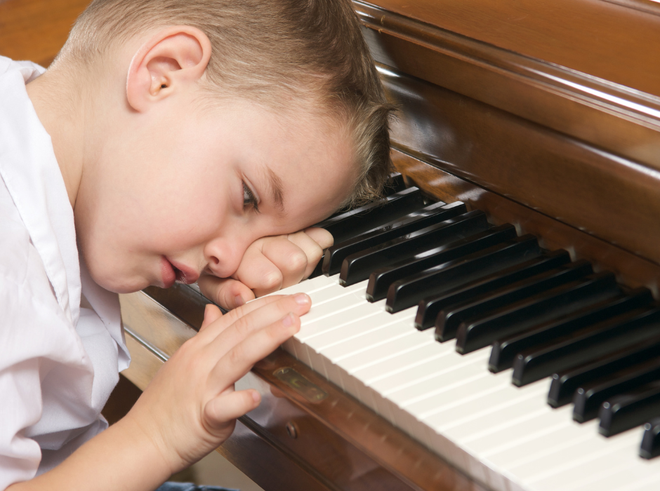 frustrated kid at piano