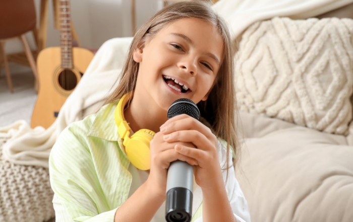 girl with microphone and headphones singing