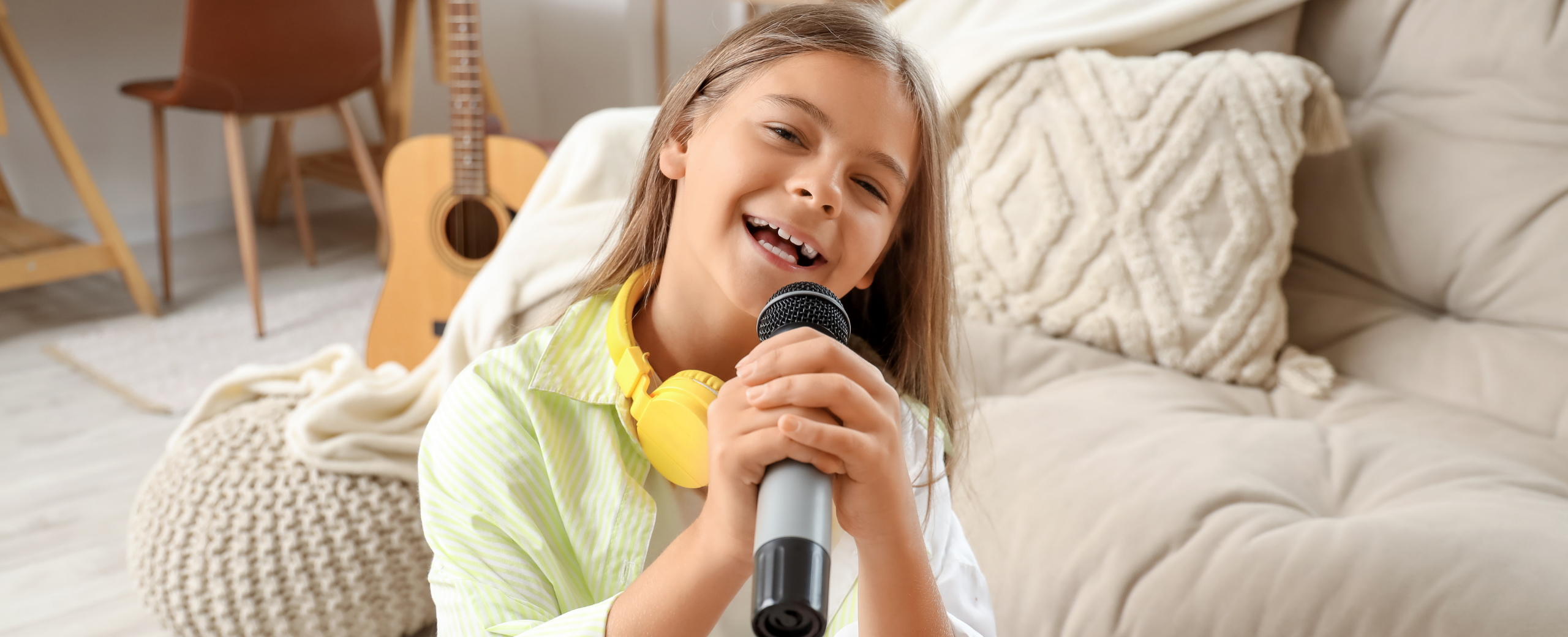 girl with microphone and headphones singing